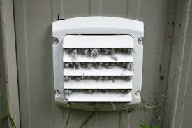 A white vent with many small birds on it.